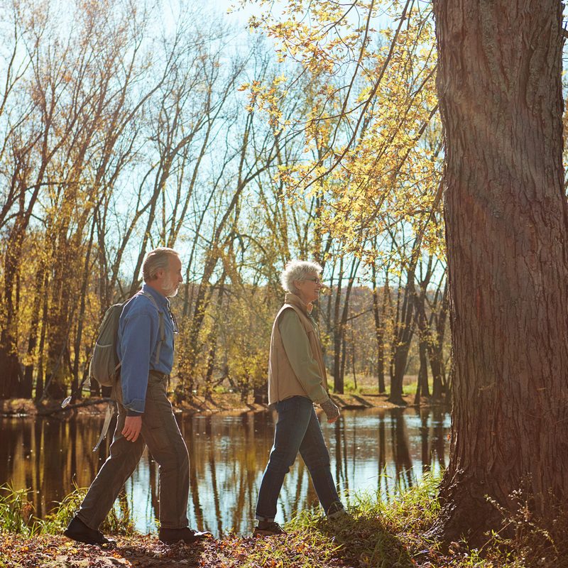 Older couple relaxing getaway holiday by river